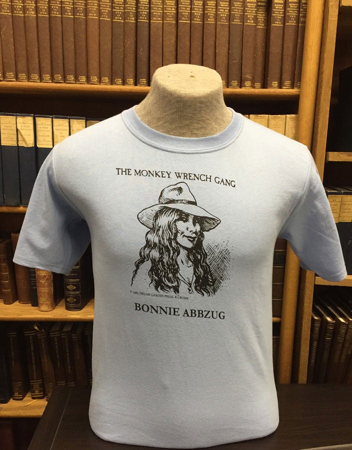 Item #13480 Bonnie Abbzug T-Shirt - Blue (XXL); The Monkey Wrench Gang T-Shirt Series. Edward Abbey/R. Crumb.