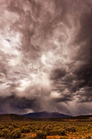 Item #27731 Photo. Storm over the La Sals. Nilauro Markus.