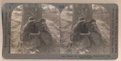 Item #46689 "Nursed the Little Hiawatha, Rocked Him in His Linen Cradle." 158 - (11941) An Indian Mother and Her Child, Michigan. Stereoview.